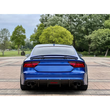 Carbon fiber rear diffuser installed on blue Audi A7 - rear view