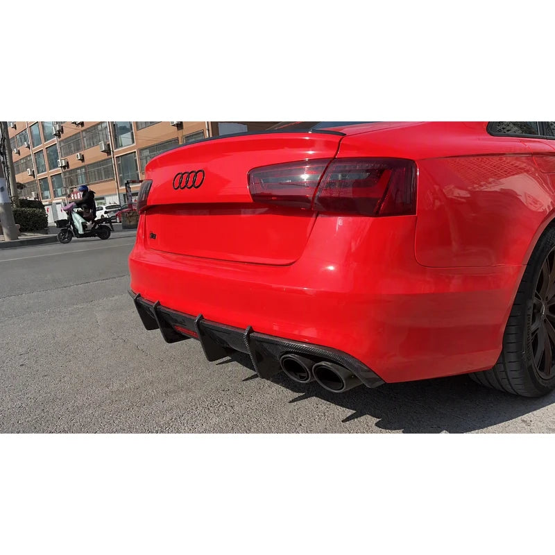 Carbon fiber rear diffuser installed on red Audi A6 - rear view