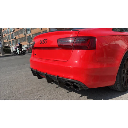 Carbon fiber rear diffuser installed on red Audi A6 - rear view
