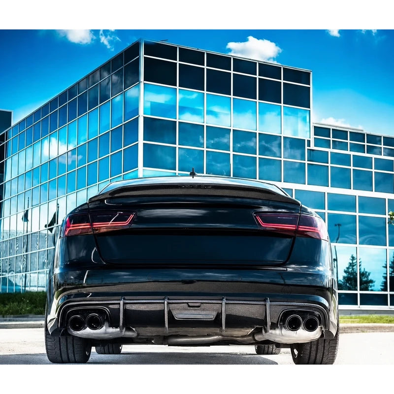 Carbon fiber ducktail spoiler installed on black Audi A6 - rear view
