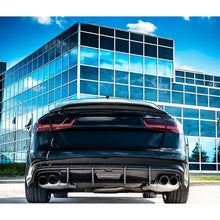 Carbon fiber ducktail spoiler installed on black Audi A6 - rear view