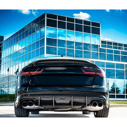 Carbon fiber ducktail spoiler installed on black Audi A6 - rear view