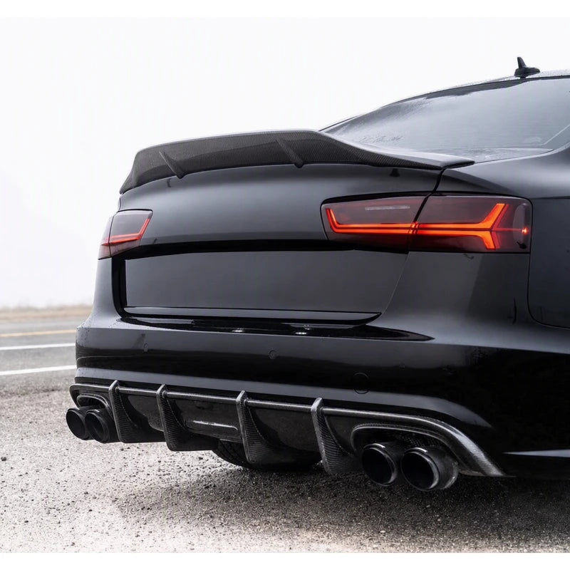 Carbon fiber ducktail spoiler installed on black Audi A6 - close-up