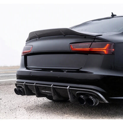 Carbon fiber ducktail spoiler installed on black Audi A6 - close-up