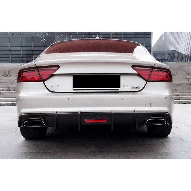 Carbon fiber rear diffuser installed on white Audi A7 - rear view with quad exhaust