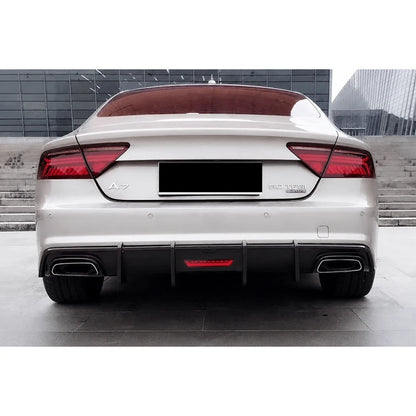Carbon fiber rear diffuser installed on white Audi A7 - rear view with quad exhaust
