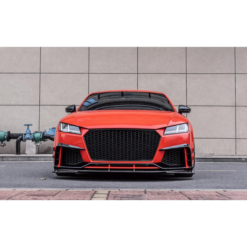Carbon fiber front lip splitter installed on orange Audi TT RS - front view