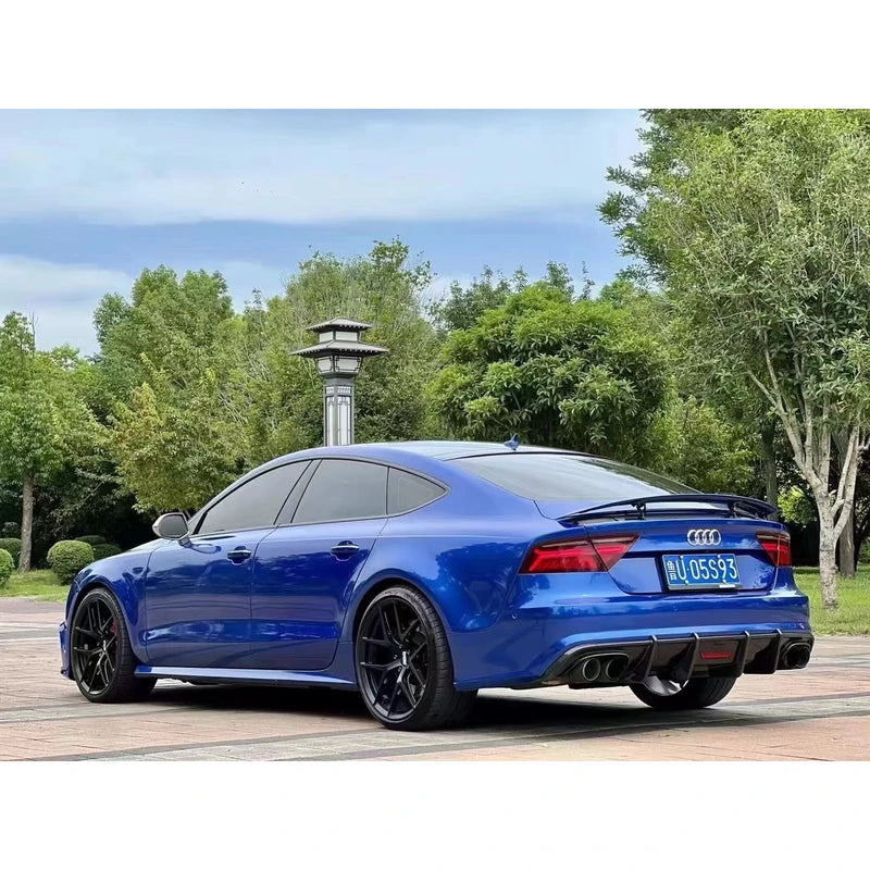 Carbon fiber rear diffuser installed on blue Audi A7 - three-quarter view