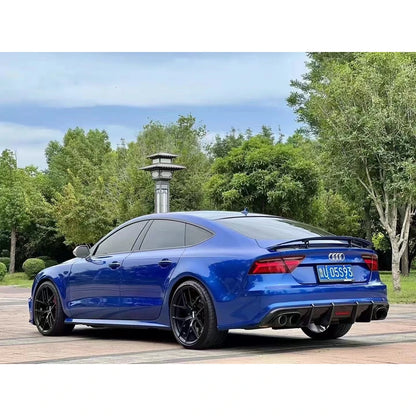 Carbon fiber rear diffuser installed on blue Audi A7 - three-quarter view