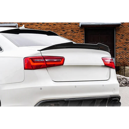 Carbon fiber ducktail spoiler installed on white Audi A6 - rear view
