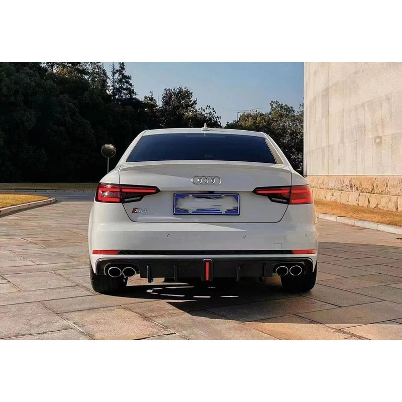 Carbon fiber rear diffuser installed on white Audi A4 - rear view