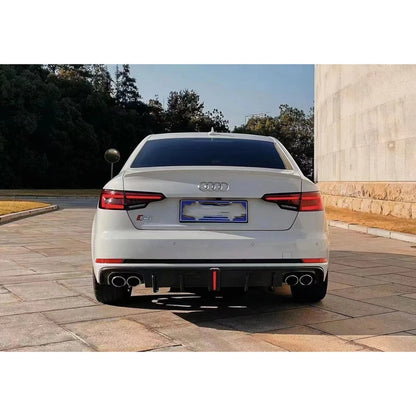 Carbon fiber rear diffuser installed on white Audi A4 - rear view