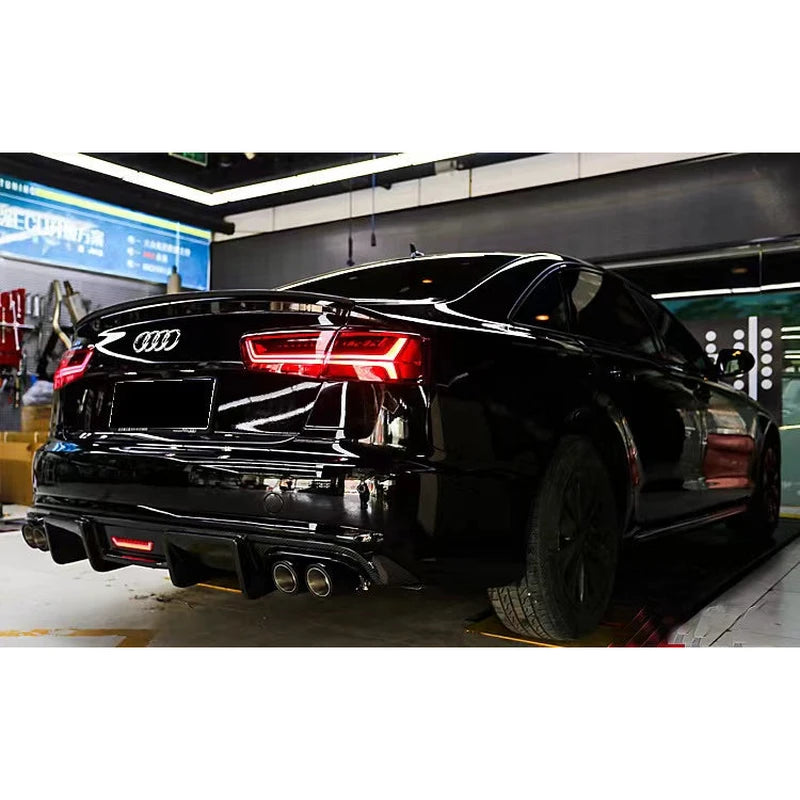 Carbon fiber rear diffuser installed on black Audi A6 - rear view