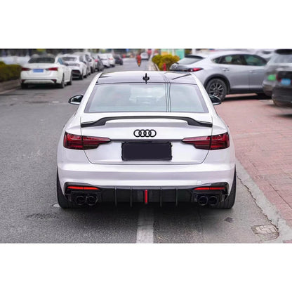 Carbon fiber rear diffuser installed on white Audi A4 - rear view