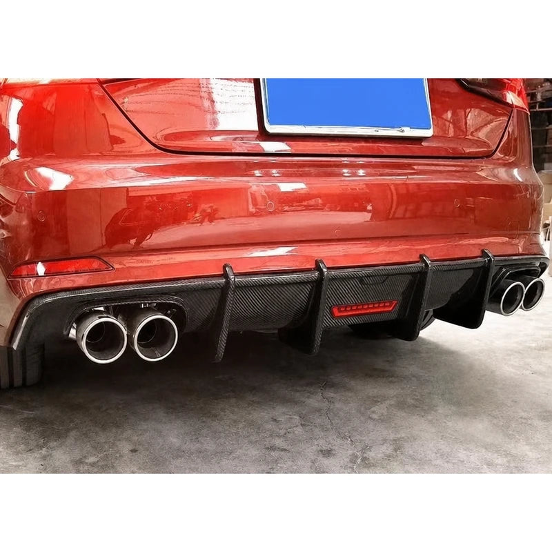 Carbon fiber rear diffuser installed on red Audi A5 - bumper close-up